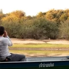 People observing wildlife by boat in the Southern Pantanal.