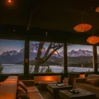 View of Hotel Lago Grey's lounge room at night, Chile.