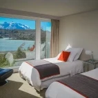 Bedroom with a twin bed set-up at the Hotel Lago Grey, with a view. Chile.