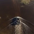 Aerial view of a safari vehicle on a drive in Botswana.