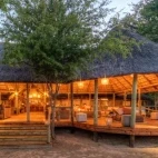 External view of the indoor lounge area at Dinaka Camp, in the Central Kalahari Game Reserve.