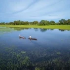 Karangoma guests out on a mokoro safari, Botswana.
