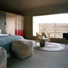 View of a double room at Hoanib, with ample space and a place to relax in private.