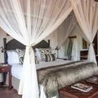View of the large bed in one of the Jock Safari Lodge suites.