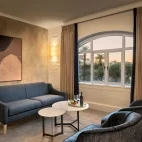 A lounge area in a bedroom, at the Victoria & Alfred Hotel, Cape Town