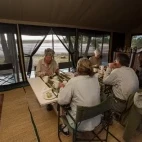 Guests eating at Salei Plains Mobile Tented Camp.