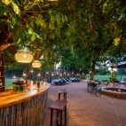 View of the bar and dining area, with cosy camp fire to sit around in the evening.