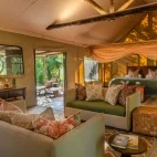 Double bed set up at Zungulila, with view of the private lounge area.