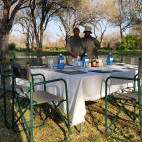 Outdoor dining at Bush Lark Mobile Tented Camp, Botswana