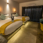 Twin bedroom at Pangolin Chobe Hotel in Botswana.