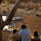 Group watching rhino in Etosha National Park, near Halali Camp in Namibia