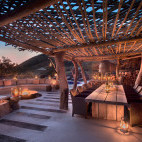 Outdoor dining and lounge area at Tarkuni Lodge in Tsawlu Private Game Reserve, South Africa.