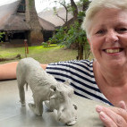 Client with warthog sculpture on our Wildlife Art Safari in South Luangwa, Zambia