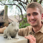 Client with hippo sculpture on our Wildlife Art Safari in South Luangwa, Zambia