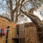 Open-air shower at Tafika Camp in South Luangwa National Park, Zambia.