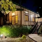 External view of a lodge at night, Infinity Resort Kaziranga, India