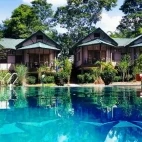 The pool area and lodges at Infinity Resort Kaziranga, India