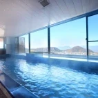View of the indoor hot spring bath area at Hotel Tsubakino, Japan