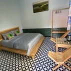 View of the double bed set-up at Cat Tien National Park Bungalows.