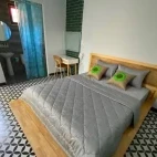 A double room with en suite and desk, at Cat Tien National Park Bungalows.