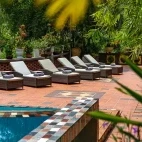 Loungers by the swimming pool at Victory Road Villas, Vietnam