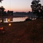River at sunset near Flame of the Forest in Kanha National Park, India