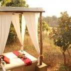 Outdoor bed at Flame of the Forest in Kanha National Park, India