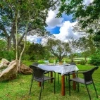 Outdoor dining at Grand Tamarind Lake Hotel in Sri Lanka