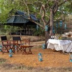 Outdoor dining and seating area at the Leopard Trails Camp in Sri Lanka