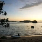 View of the beachfront during sunrise at Reef Resort.