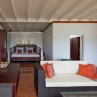 View of a deluxe suite at Reef Resort, complete with private lounge area.