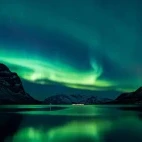 View of the stunning Northern Lights spectacle in the Norwegian Fjords.