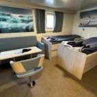 Example of the twin superior cabin on Virgo, with lounge area.
