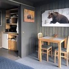 Dining area and kitchenette at the Bear Centre Luxury Cabins in Kainuu, Finland.