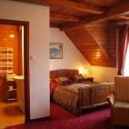 Bedroom and bathroom at Dworek Gawra in Białowieża, Poland