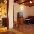 Bedroom and lounge area at Dworek Gawra in Białowieża, Poland