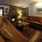 Fireplace and seating in the reception area at The Old Inn in Gairloch, Scotland