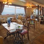 Dining area at Bamburgh Castle Inn, overlooking Seahouses Harbour in Northumberland