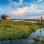 Old harbour and salt marshes at Thornham, North Norfolk Coast