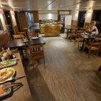 The dining area on Mutum Expeditions Houseboat, Brazil.