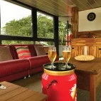 Lounge area on board Mutum Expeditions Houseboat, Brazil