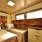 A twin room on Mutum Expeditions Houseboat, Brazil