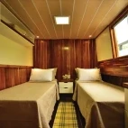 A twin room on Mutum Expeditions Houseboat, Brazil