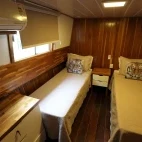 A twin room on Mutum Expeditions Houseboat, Brazil.