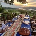 The outdoor dining area at Minga Lodge, complete with stunning views of the Ecuadorian Amazon.