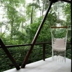 Decking area and hammock seat for relaxing at your sanctuary cabin.