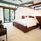 Example of the bedroom area in Minga Lodge's sanctuary cabins.