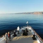 External view of Safari Voyager's bow, with guests enjoying the views.