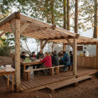 Outdoor seating at Orca Waters Base Camp in Vancouver Island, Canada.