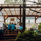 Outdoor seating at Orca Waters Base Camp in Vancouver Island, Canada.
